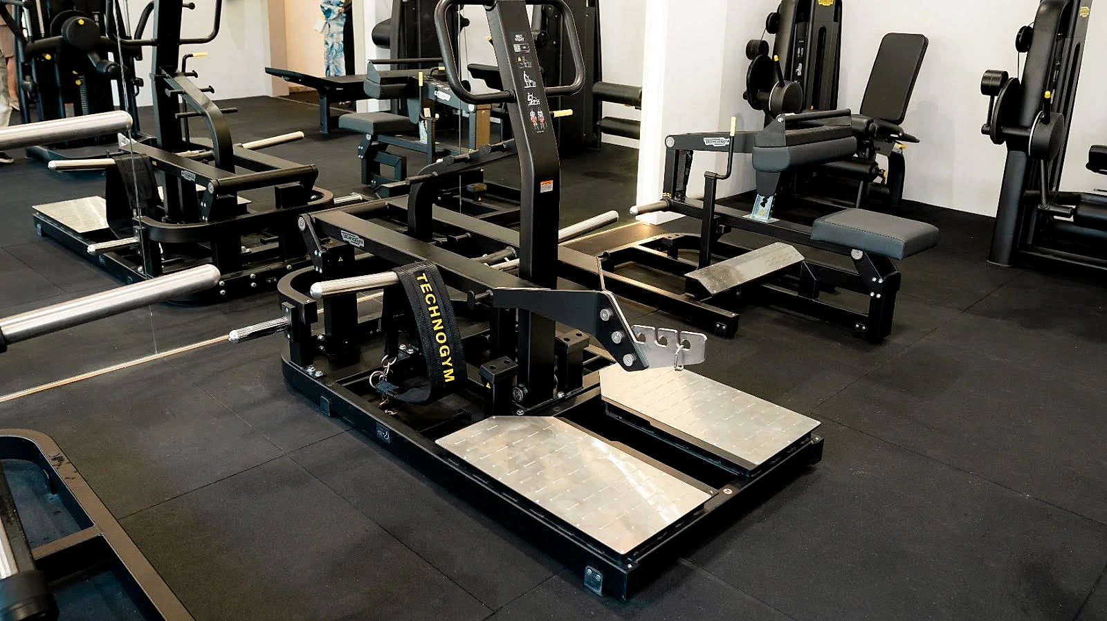 The strength floor, lined with plate-loaded resistance machines.
